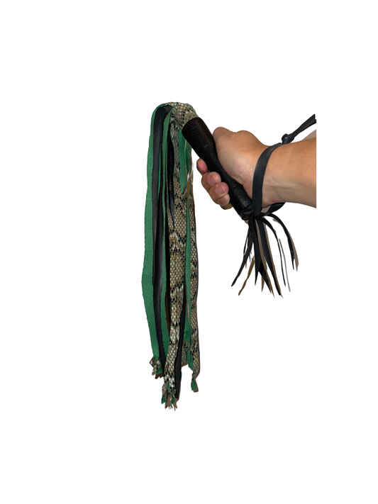 Eco-friendly Green Snakeskin Vegan Flogger being held by hand, made from recycled bike tires and inner tubes.