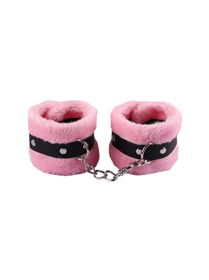 Pink furry handcuffs with adjustable buckle and soft faux fur lining, ideal for beginners exploring playful restraint.