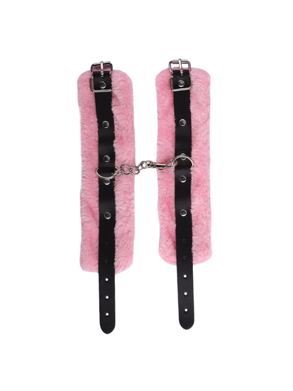 Pair of pink soft bondage cuffs with faux fur and metal clip, comfortable and adjustable for gentle restraint play.