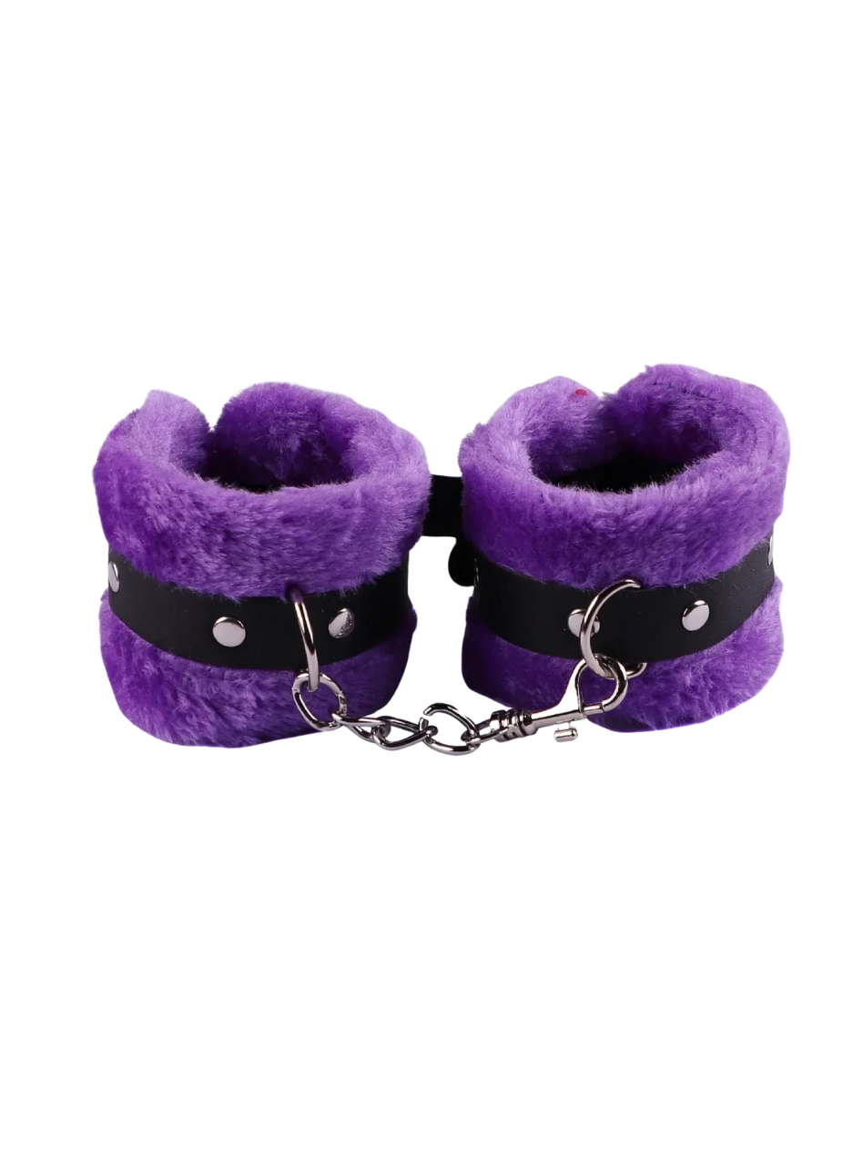 Purple furry handcuffs with faux fur and secure buckle, gender-inclusive and perfect for playful restraint.