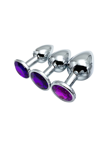 Three purple jewelled metal butt plugs in small, medium, and large sizes for comfortable anal play