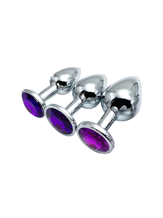 Three purple jewelled metal butt plugs in small, medium, and large sizes for comfortable anal play