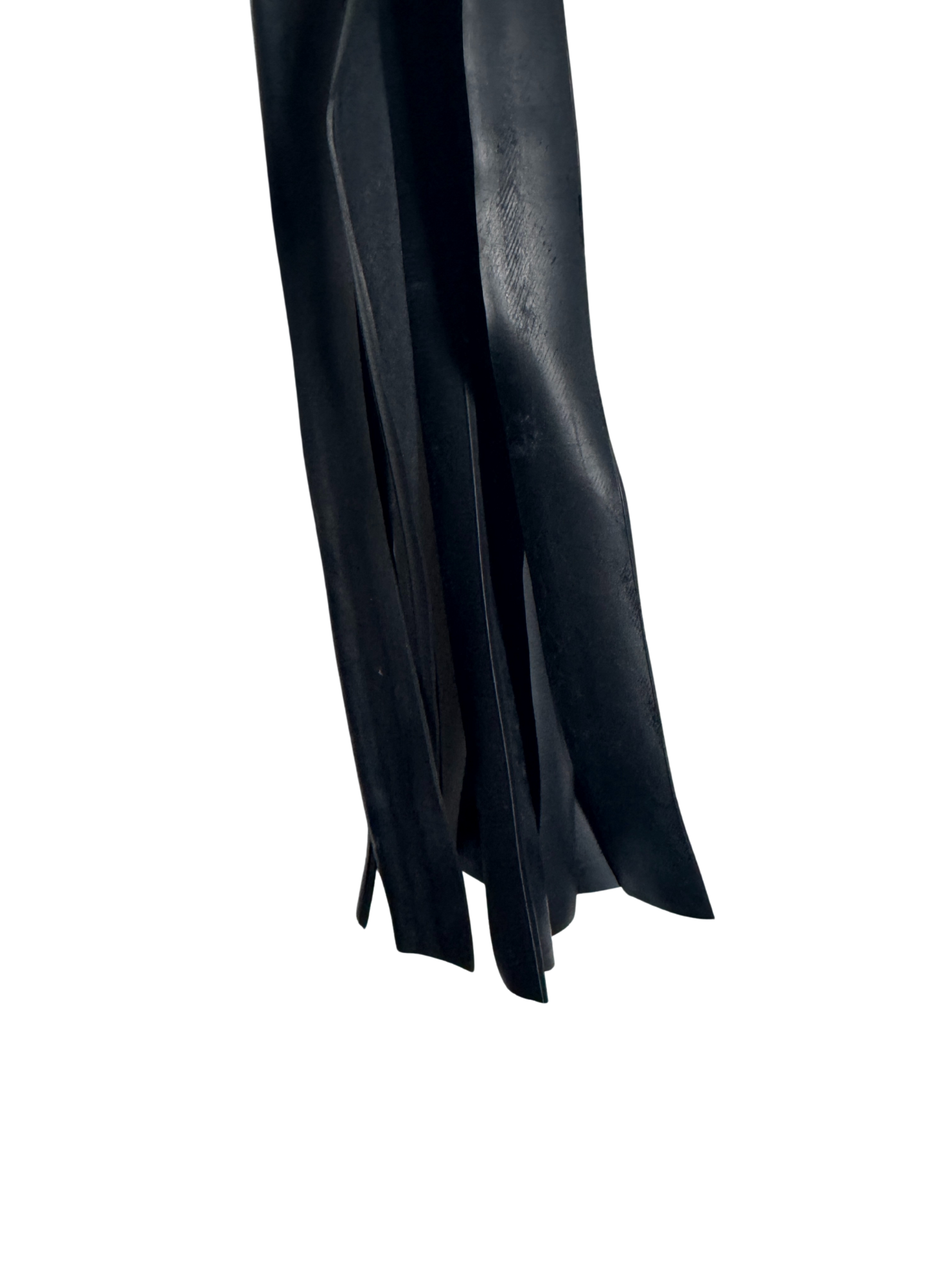 Close-up view of soft black faux leather flogger strands